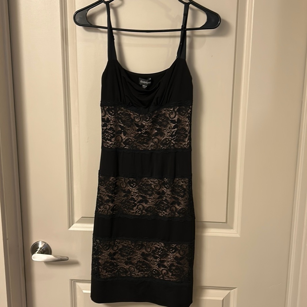 Bebe lace nude and black size small skin tight party dress.